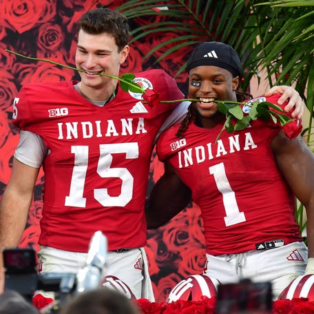 Indiana quarterback Fernando Mendoza (15) and running back Roman Hemby (1) celebrate after defeating Alabama in the College Football Playoff quarterfinals at the 2026 Rose Bowl.