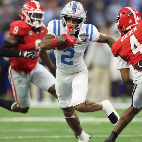 Mississippi wide receiver Harrison Wallace III (2) tries to avoid the tackle of Georgia defensive back Kj Bolden (4) during the College Football Playoff quarterfinal at the Sugar Bowl in New Orleans,