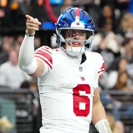 New York Giants quarterback Jaxson Dart (6) celebrates a touchdown in the second quarter against the Las Vegas Raiders at Allegiant Stadium.