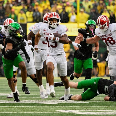 Oct 11, 2025; Eugene, Oregon, USA; Indiana Hoosiers wide receiver Elijah Sarratt (13) runs with the ball after making a catch against against the Oregon Ducks during the fourth quarter at Autzen Stadium. Mandatory Credit: Troy Wayrynen-Imagn Images