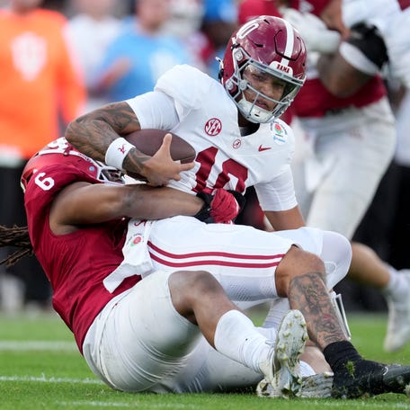 Jan 1, 2026; Pasadena, CA, USA; Indiana Hoosiers defensive lineman Mikail Kamara (6) sacks Alabama Crimson Tide quarterback Austin Mack (10) in the second half of the 2026 Rose Bowl and quarterfinal game of the College Football Playoff at Rose Bowl Stadium. Mandatory Credit: Kirby Lee-Imagn Images