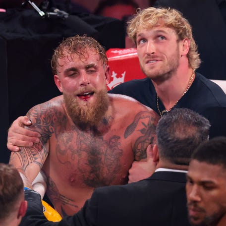 Jake Paul is hugged by his brother Logan Paul after losing to Anthony Joshua.