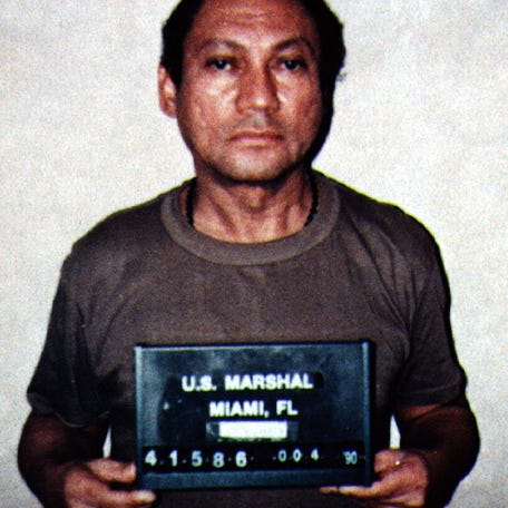Manuel Noriega is shown in this file photo taken during his arrest by U.S. Drug Enforcement Agency agents in 1990.