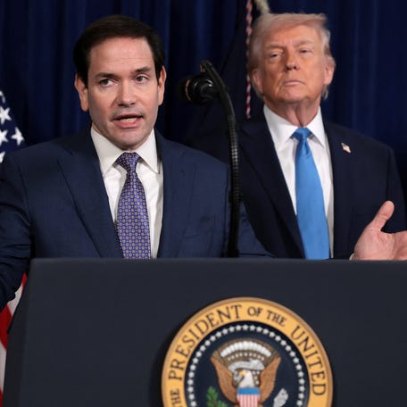 Secretary of State Marco Rubio and President Donald Trump address reporters at Trump's Mar-a-Lago estate in Palm Beach, Florida, on Jan. 3, 2026, after a U.S. strike on Venezuela.