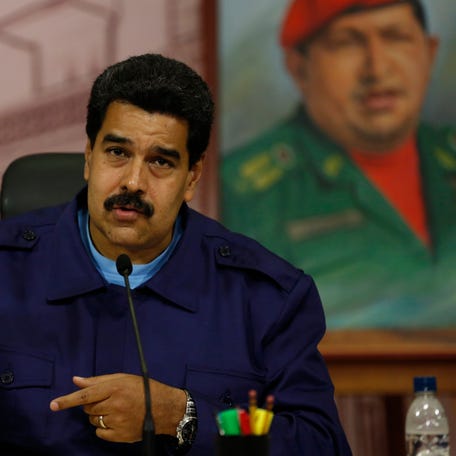 Venezuelan President Nicolas Maduro attends a press conference at Miraflores Palace in Caracas February 21, 2014.
