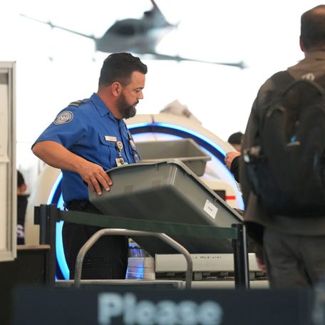 Transportation Security Administration employees work the security line during the government shutdown, at McGhee Tyson airport, in Alcoa, Tenn., Nov. 6, 2025.
