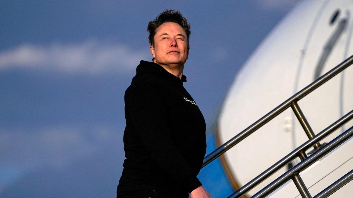 Tesla CEO Elon Musk boards Air Force One with U.S. President Donald Trump (not pictured) as they depart for Philadelphia, Pennsylvania, from Morristown Municipal Airport in Morristown, New Jersey, U.S., March 22, 2025.