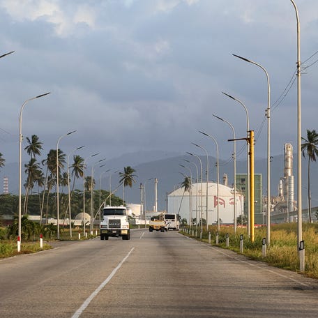 PUERTO CABELLO, VENEZUELA - DECEMBER 18: Drivers pass by the Hugo Chavez petrochemical facilities during a walk around the refinery outskirts on December 18, 2025 in Puerto Cabello, Venezuela.
