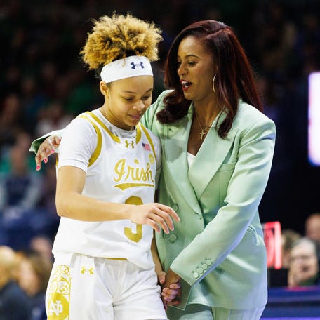 Notre Dame head coach Niele Ivey, right, embraces guard Hannah Hidalgo (3) as Hidalgo comes off the court during a NCAA women's basketball game between No. 1 Notre Dame and No. 11 Duke at Purcell Pavilion on Monday, Feb. 17, 2025, in South Bend.