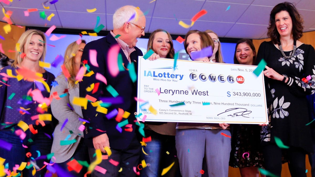 Lerynne West steps forward to claim a $343.9 million Powerball jackpot, the largest prize in Iowa history, Nov. 5, 2018.