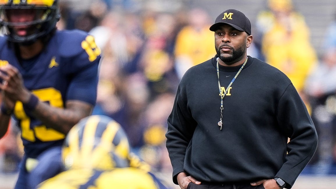 Michigan head coach Sherrone Moore watches a play behind quarterback Bryce Underwood (19) during the second half of the spring game at Michigan Stadium in Ann Arbor on Saturday, April 19, 2025.