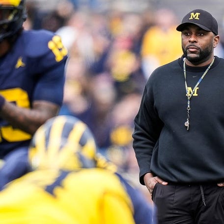 Michigan head coach Sherrone Moore watches a play behind quarterback Bryce Underwood (19) during the second half of the spring game at Michigan Stadium in Ann Arbor on Saturday, April 19, 2025.