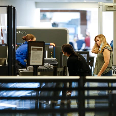 Travelers make their way trough a TSA checkpoint at the Springfield-Branson National Airport on Tuesday, April 19, 2022.