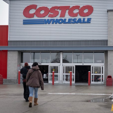 Customers walk in the parking lot outside a Costco store on December 02, 2025 in Chicago, Illinois.