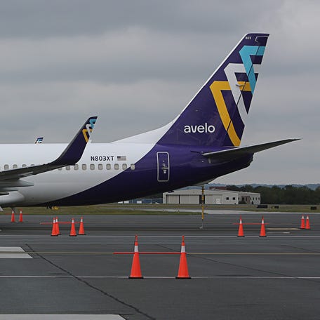An Avelo Airlines plane sits on the tarmac of the Wilmington Airport on Monday, Sept. 30, 2024.