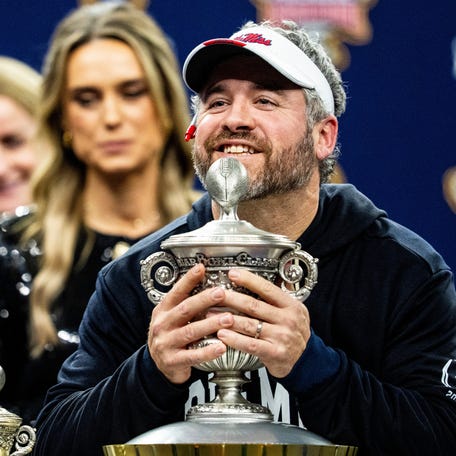 Ole Miss head coach Pete Golding lifts the Sugar Bowl trophy after the Sugar Bowl and College Football Playoff quarterfinals at Caesars Superdome in New Orleans, La., on Thursday, Jan. 1, 2026. Ole Miss defeated Georgia 39-34.
