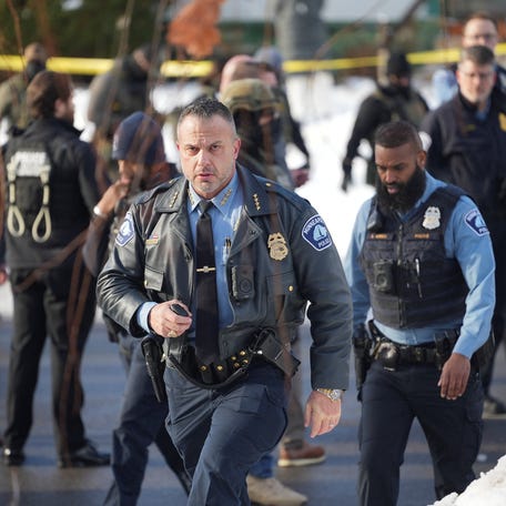 Minneapolis Police Department Chief Brian O'Hara walks at the scene where a driver was shot by a U.S. immigration agent on Jan. 7, 2026.
