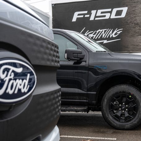 A couple 2025 Ford F-150 Lightning XLT trucks are parked on a lot at Village Ford dealership in Dearborn on Wednesday, January 7, 2026.
