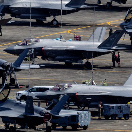 Personnel work on U.S. Air Force F-35 Lightning II fighter jets in Ceiba, Puerto Rico, on Jan. 3, 2026.