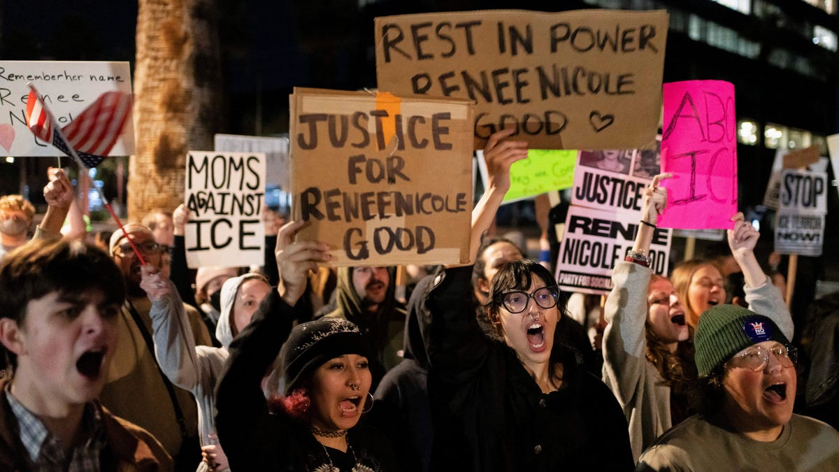 People hold signs and chant during a protest the day after the fatal shooting of Minneapolis resident Renee Nicole Good by a U.S. Immigration and Customs Enforcement agent, outside the ICE Field Office in Phoenix, Arizona, U.S., Jan. 8, 2026.