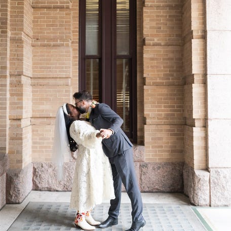 Faced with the loss of her health insurance, Houston resident Mila Clarke, left, married her partner in a December 2025 ceremony. Clarke joined her husband's corporate health insurance plan following the wedding.