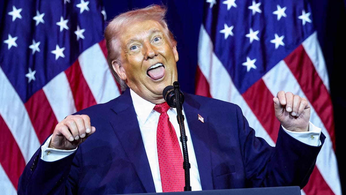 President Donald Trump gestures as he makes an impression of a transgender weightlifter during his address to House Republicans in Washington, DC, on Jan. 6, 2026.