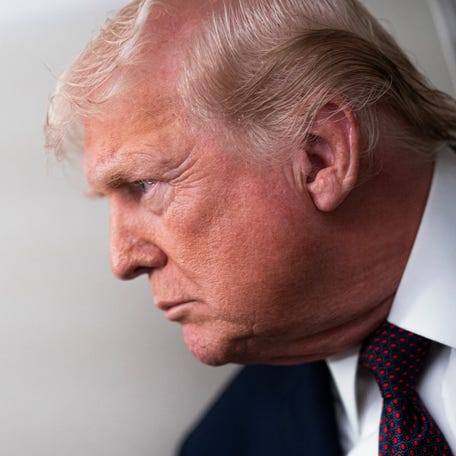 President Donald Trump speaks with members of the media aboard Air Force One en route from Florida to Joint Base Andrews, Maryland, U.S., January 11, 2026.