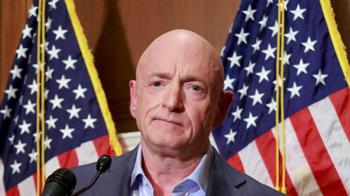 Sen. Mark Kelly, D-Arizona, holds a press conference at the U.S. Capitol in Washington, D.C., on Dec. 1, 2025.