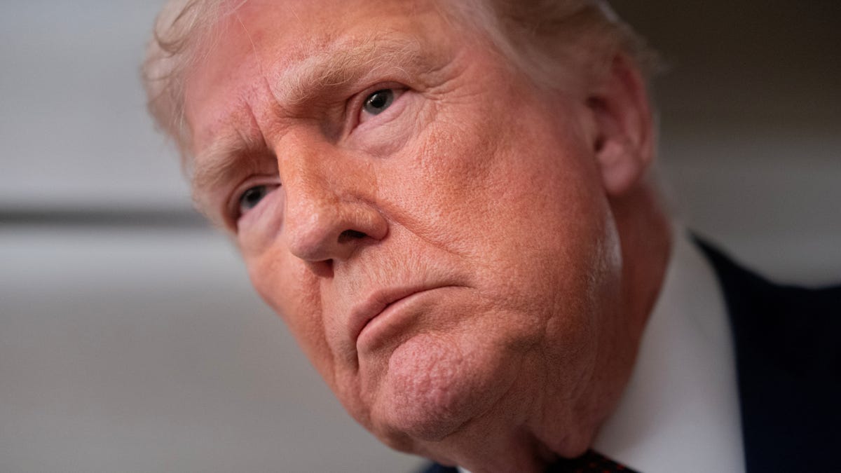 President Donald Trump speaks with members of the media aboard Air Force One en route from Florida to Joint Base Andrews, Maryland, U.S., January 11, 2026.