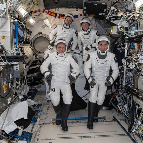 Four SpaceX Crew-11 members — NASA astronaut Mike Fincke, Roscosmos cosmonaut Oleg Platonov, NASA astronaut Zena Cardman, and JAXA (Japan Aerospace Exploration Agency) astronaut Kimiya Yui — pose for a portrait inside the International Space Station.