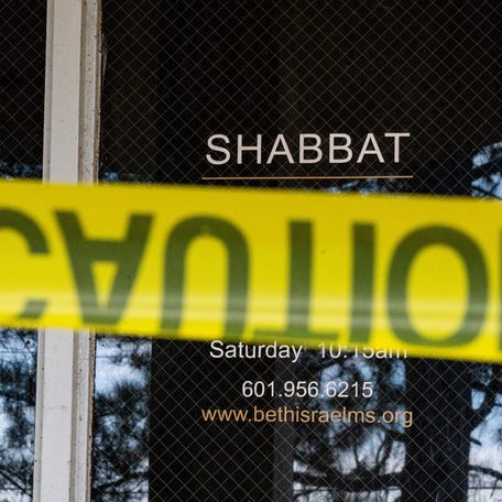 Caution tape blocks an entryway at Beth Israel Congregation synagogue in Jackson, Miss., on Sunday, Jan. 11, 2026.