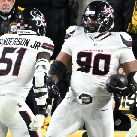 Jan 12, 2026; Pittsburgh, PA, USA; Houston Texans defensive tackle Sheldon Rankins (90) celebrates with Houston Texans defensive end Will Anderson Jr. (51) and safety Jalen Pitre (5) after returning a fumble for a touchdown during the second half of an AFC Wild Card Round game against the Pittsburgh Steelers at Acrisure Stadium. Mandatory Credit: Barry Reeger-Imagn Images