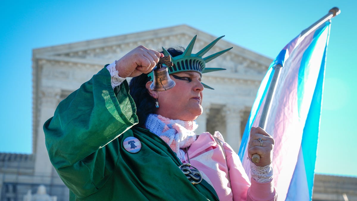 Demonstrators rally outside of the Supreme Court as the justices hear oral arguments in two cases related to transgender athlete participation in sports in Washington, DC, on Jan. 13, 2026. The cases, Little v. Hecox and West Virginia v. B.P.J., seek to decide whether laws that limit participation to women and girls based on sex violate the equal protection clause of the 14th Amendment.
