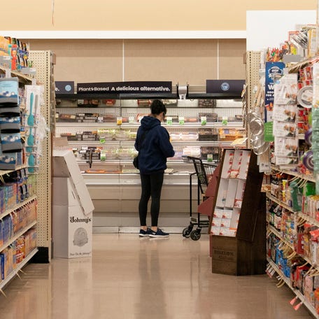 FILE PHOTO: A food shopper browses for groceries ahead of the Thanksgiving Day holiday at an Albertsons supermarket in Redmond, Washington, U.S., November 24, 2025. REUTERS/David Ryder/File Photo