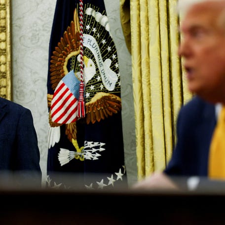 FILE PHOTO: White House economic adviser Kevin Hassett stands next to U.S. President Donald Trump in the Oval Office of the White House in Washington, D.C., U.S., March 7, 2025. REUTERS/Leah Millis/File Photo