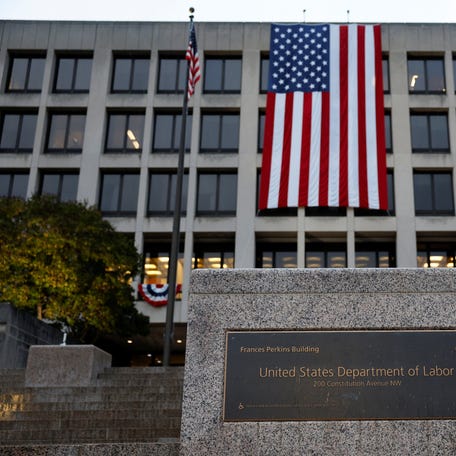 An American flag hangs on the Department of Labor headquarters, in Washington, D.C., U.S., September 16, 2025.