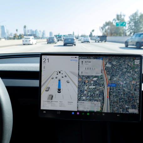 A 2025 Tesla Model 3 self-drives with FSD 14.1.4 software on a freeway in Los Angeles, California, U.S., November 6, 2025.