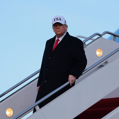 President Donald Trump disembarks Air Force One, on his return from Detroit, Michigan, at Joint Base Andrews, Maryland, U.S., January 13, 2026.