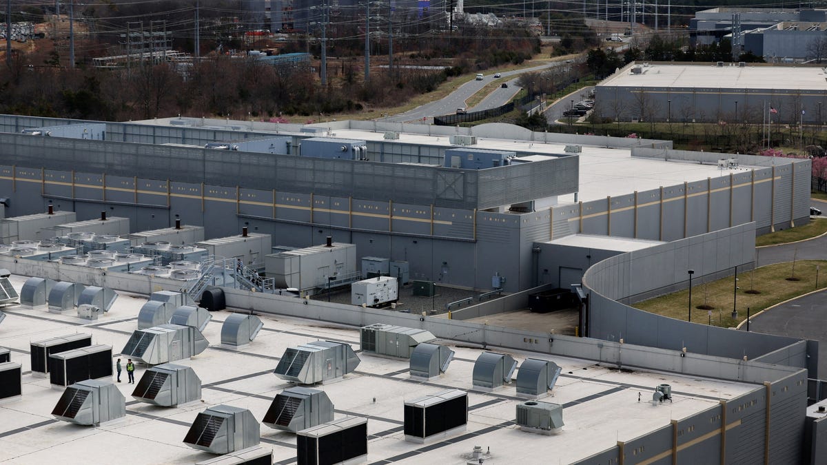 Cars drive by Digital Realty Data Center buildings in Ashburn, Virginia.
