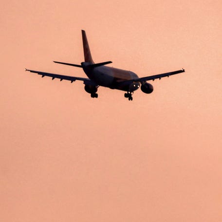 An Airbus A320 aircraft of Iranian airline Qeshm Air flies.