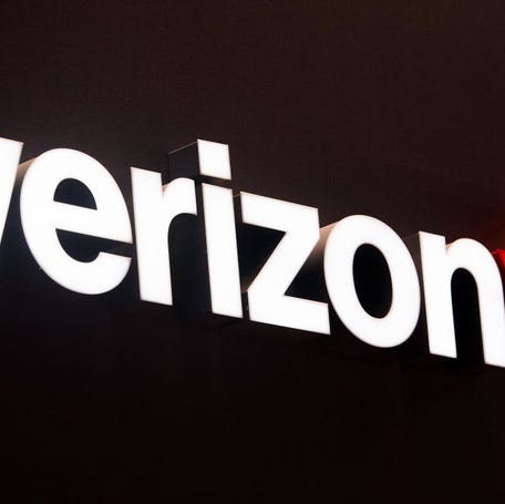 A logo sits illuminated outside the Verizon pavilion during the Mobile World Congress 2017 on the opening day of the event at the Fira Gran Via Complex on February 27, 2017 in Barcelona, Spain.