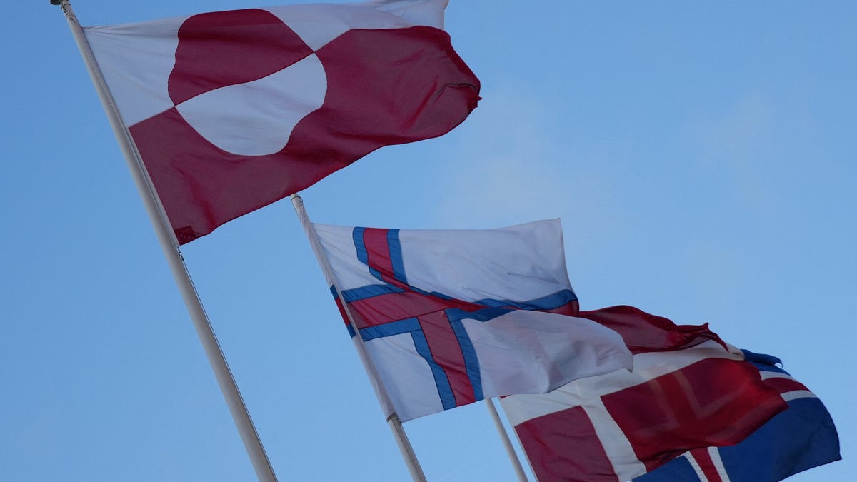 The flags of Greenland, the Faroe Islands, Denmark and Iceland flutter outside North Atlantic House in Copenhagen, Denmark, January 14, 2026. REUTERS/Tom Little