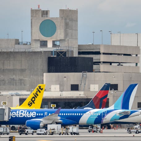 Jet Blue, Spirit and Delta airlines jets at Palm Beach International Airport on January 16, 2026, in West Palm Beach, Florida.