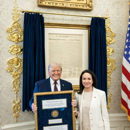 U.S. President Trump meets with Venezuelan opposition leader Maria Corina Machado in the Oval Office, during which she presented the President with her Nobel Peace Prize, in Washington, D.C, U.S., released January 15, 2026.