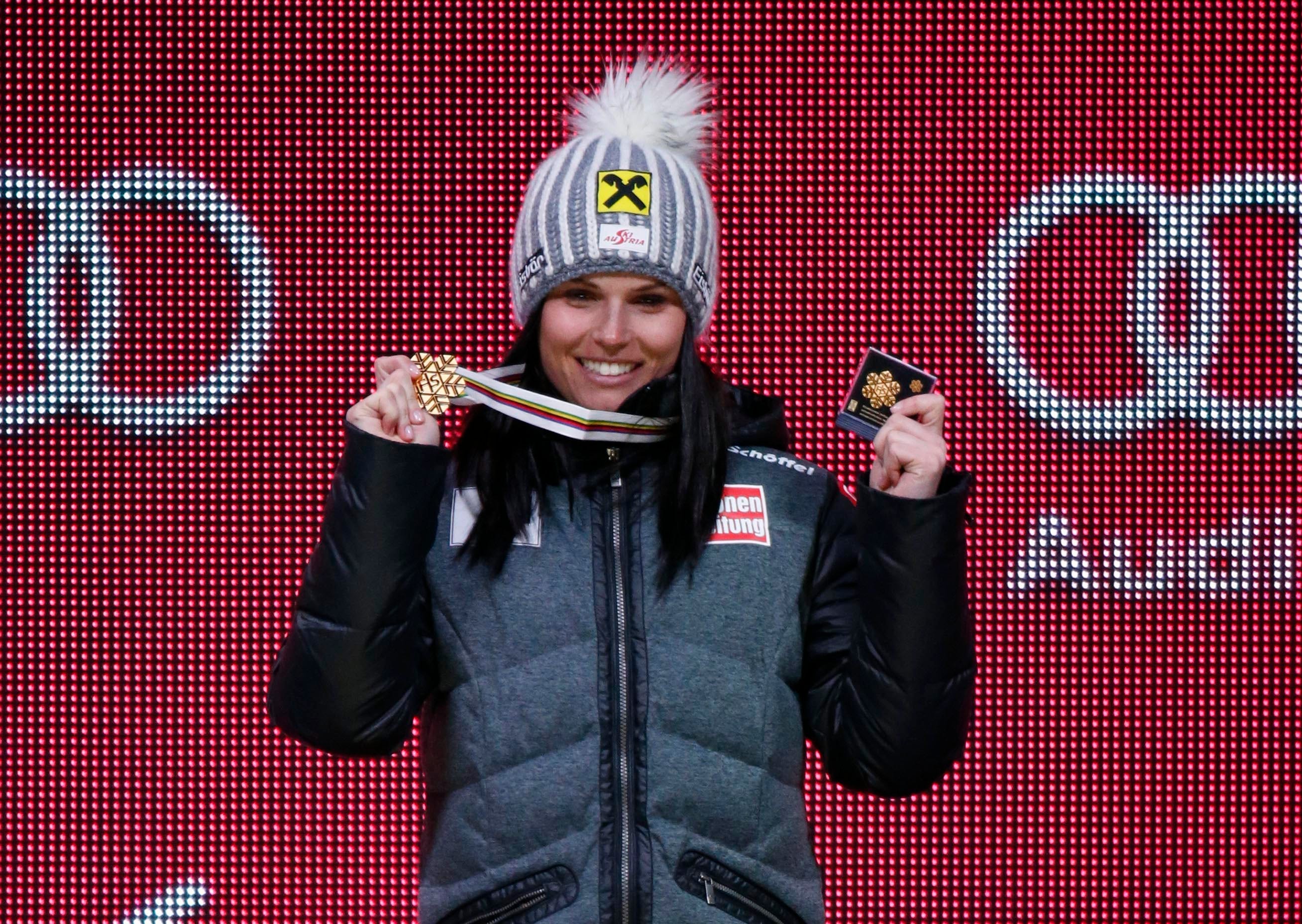 Anna Fenninger of Austria celebrates on the podium during the medals ceremony for the women's giant slalom.