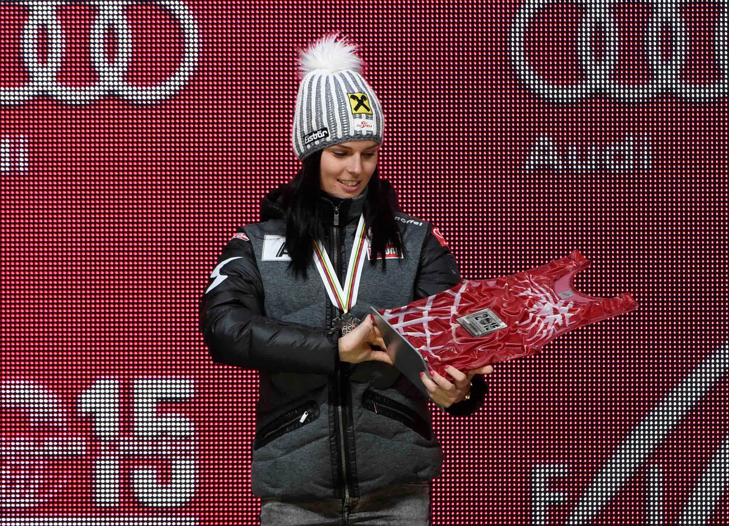 Anna Fenninger of Austria holds a bib during the medals ceremony for the women's downhill in the FIS alpine skiing world championships at Championships Plaza.