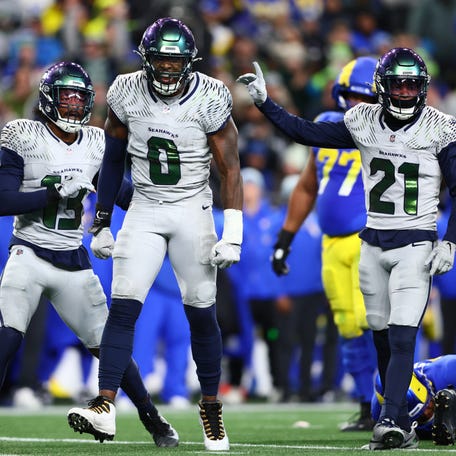 Seattle Seahawks defensive end Demarcus Lawrence (0) reacts in the second half against the Los Angeles Rams at Lumen Field on Dec. 18, 2025, in Seattle.