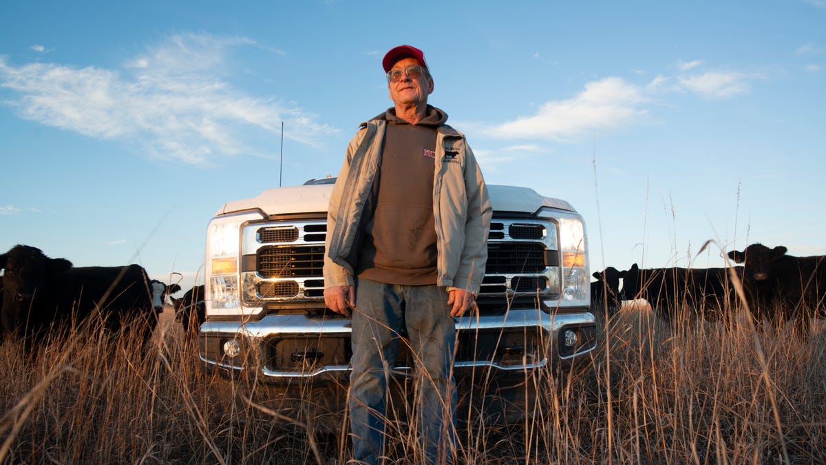 Hal Luthi poses next to his new Ford F350 pickup truck he's been able to afford thanks to raising beef prices that help sustain him and his families farm in Madison, Kansas, on Jan. 16, 2026.