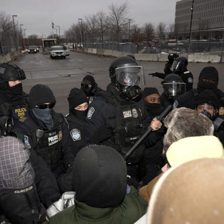 U.S. Customs and Border Protection (CBP) agents stand guard during a protest outside the Whipple Federal Building, more than a week after a U.S. Immigration and Customs Enforcement (ICE) agent fatally shot Renee Nicole Good on January 7, in Minneapolis, Minnesota, U.S., January 16, 2026.