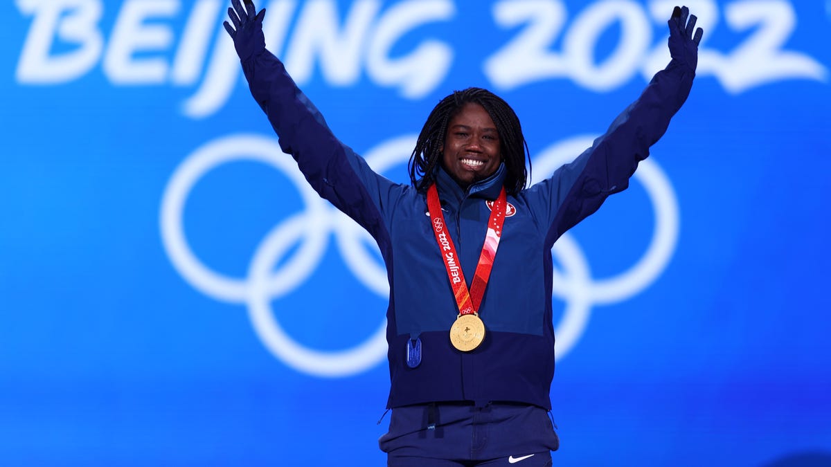 BEIJING, CHINA - FEBRUARY 14: Gold medallist Erin Jackson of Team United States celebrates during the Women's 500m medal ceremony on Day 10 of the Beijing 2022 Winter Olympics at Medal Plaza on February 14, 2022 in Beijing, China. (Photo by Dean Mouhtaropoulos/Getty Images)
